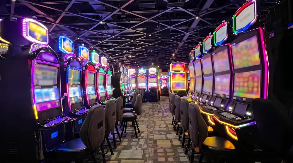 Empty slot aisle under black steel trusses